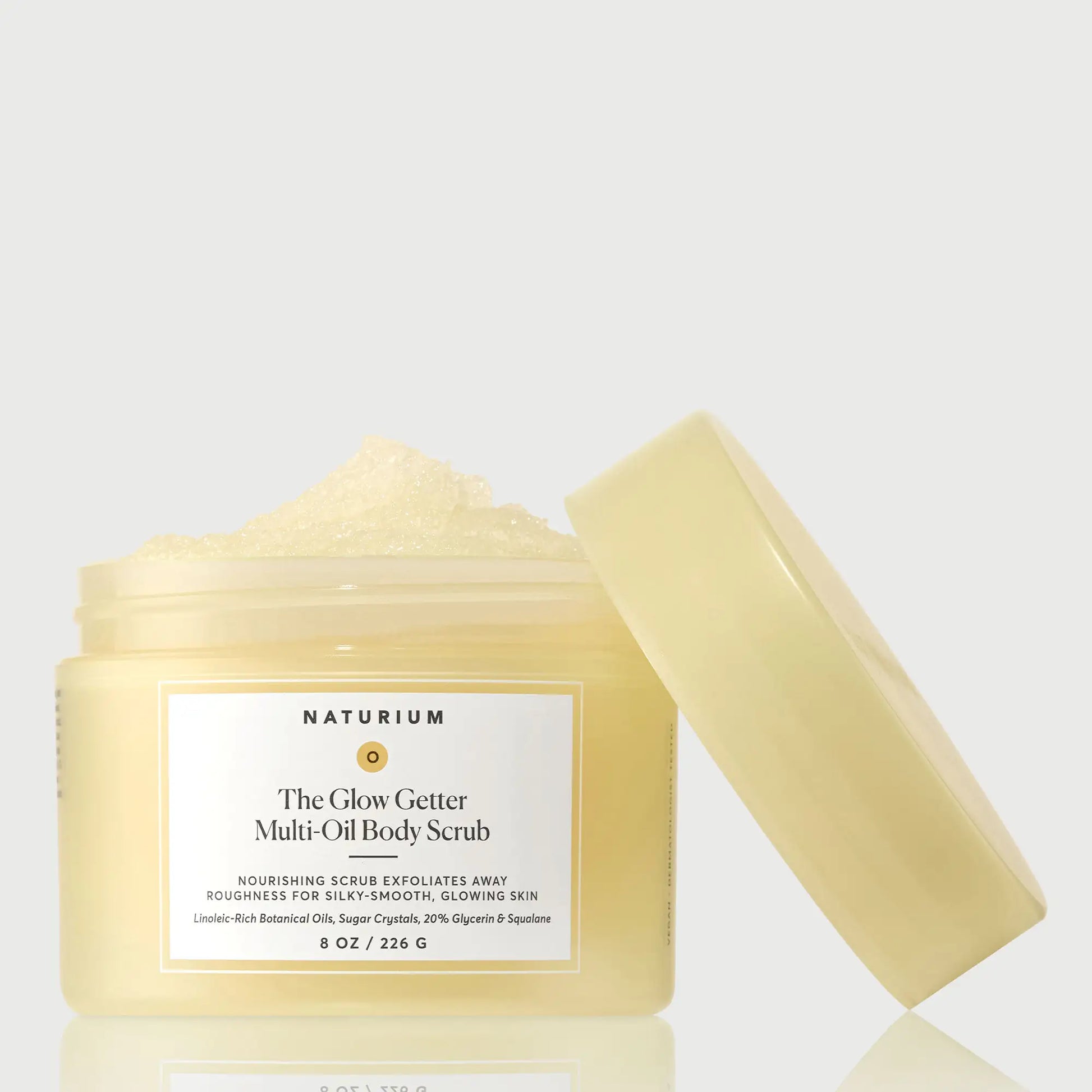the-glow-getter-multi-oil-body-scrub-n0 NATR-40028-GlowGetter-Multi-Oil-Body-Scrub-Front-CapOff-bonebkgd.webp
